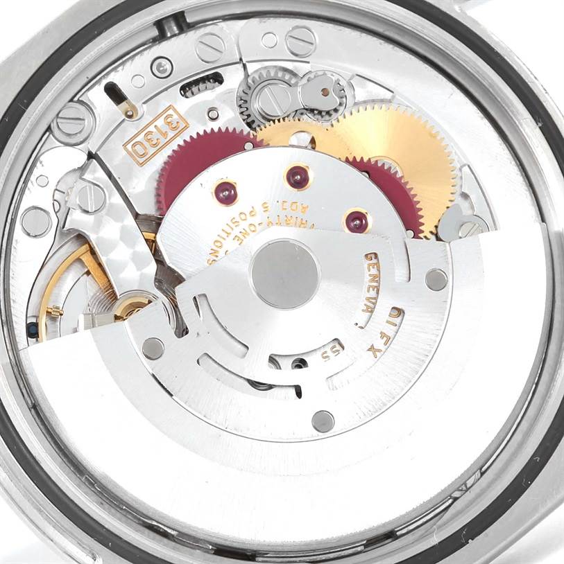 The image shows the internal mechanism of a Rolex Explorer 114270 Men's Stainless Steel Black Dial 114270 Men's Stainless Steel Black Dial watch from a rear angle, highlighting gears and the rotor.