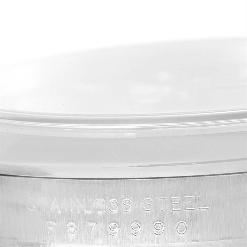 The image shows a close-up of the serial number and "STAINLESS STEEL" engraving on the side of the bezel of the Rolex Explorer 114270 Men's Stainless Steel Black Dial 114270 Men's Stainless Steel Black Dial watch.