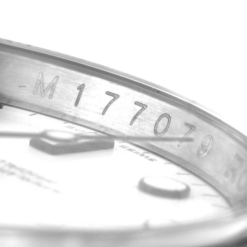 The image shows a close-up of the inner case with serial numbers on a Rolex Explorer 16570 Men's Stainless Steel White Dial 16570 Men's Stainless Steel White Dial watch.
