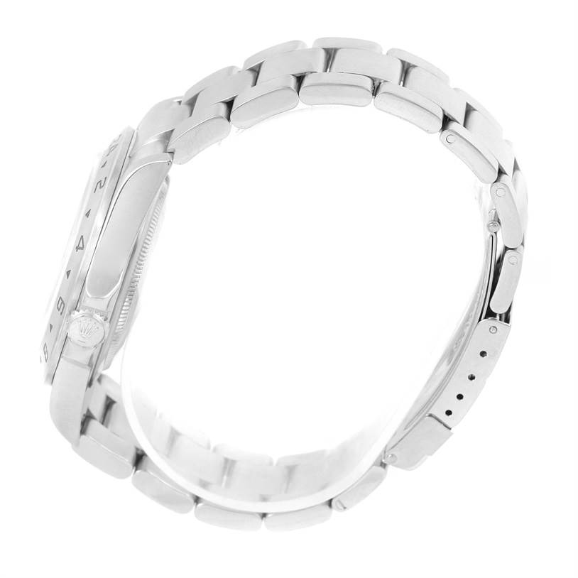 The image shows the side view of a Rolex Explorer 16570 Men's Stainless Steel White Dial 16570 Men's Stainless Steel White Dial watch, showcasing its stainless steel bracelet and clasp.