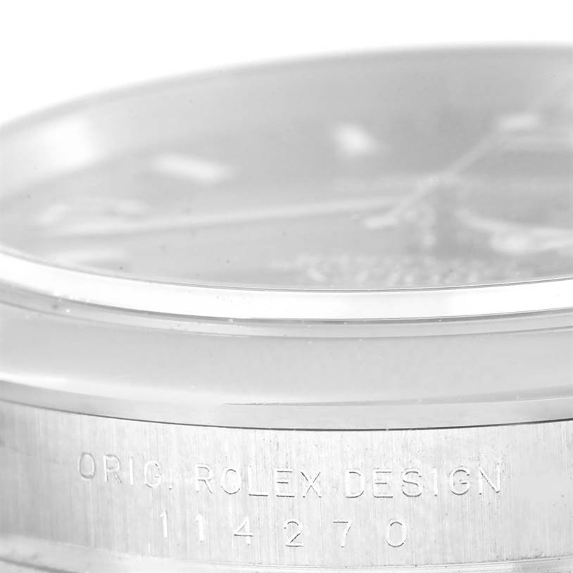 This image shows a close-up of the side angle of a Rolex Explorer 114270 Men's Stainless Steel Black Dial 114270 Men's Stainless Steel Black Dial watch, highlighting the "ORIG. ROLEX DESIGN" and model number "114270."