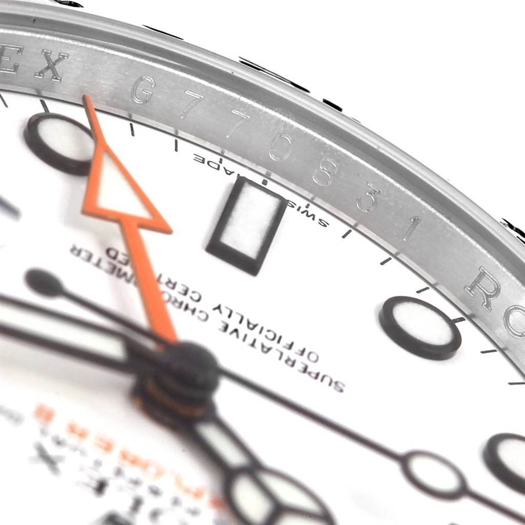 The close-up angle shows the dial, hands, and part of the bezel with engravings of a Rolex Explorer 216570 Men's Stainless Steel White Dial 216570 Men's Stainless Steel White Dial model watch.