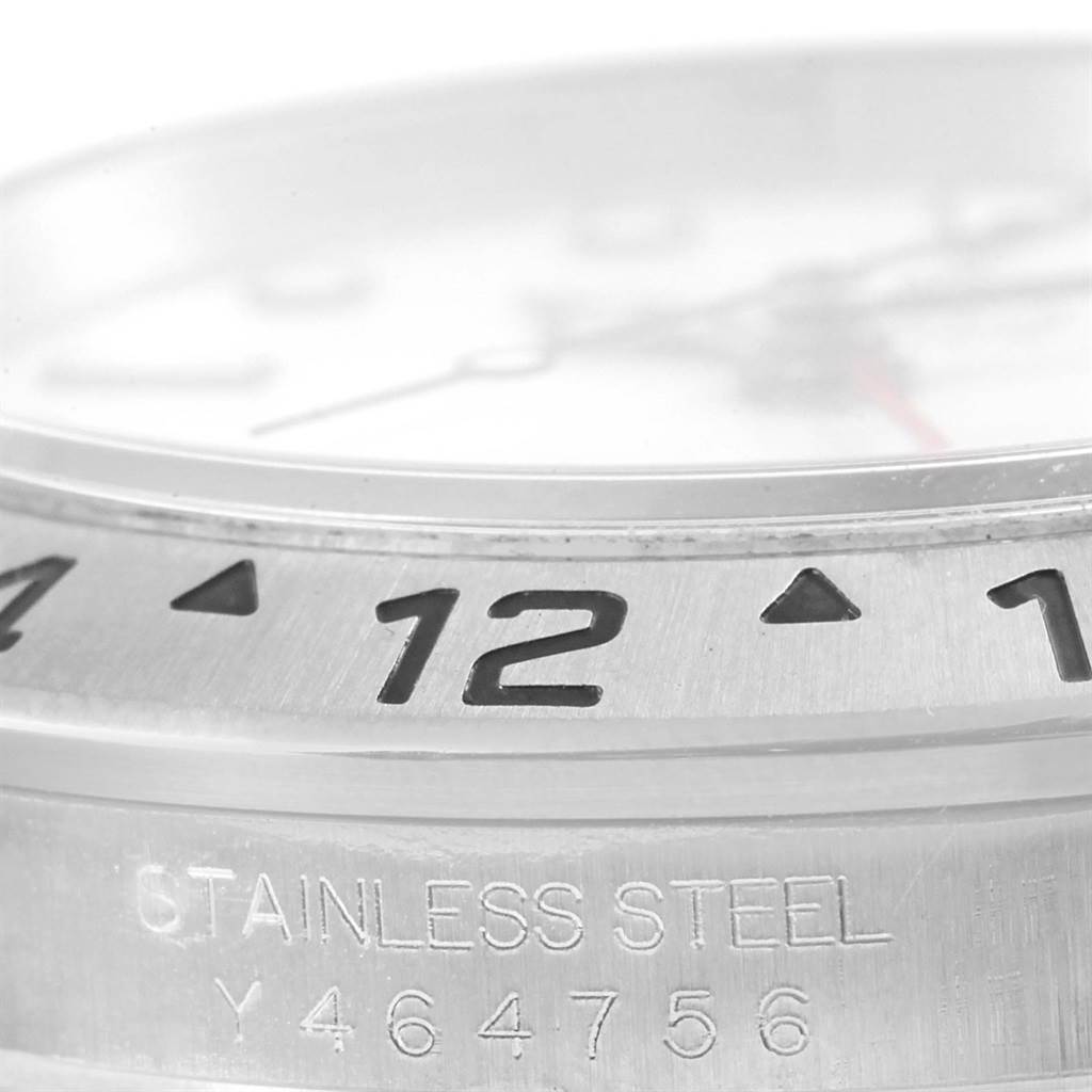 The image shows a close-up of the bezel and serial number of a Rolex Explorer 16570 Men
s Stainless Steel White Dial 16570 Men
s Stainless Steel White Dial watch.