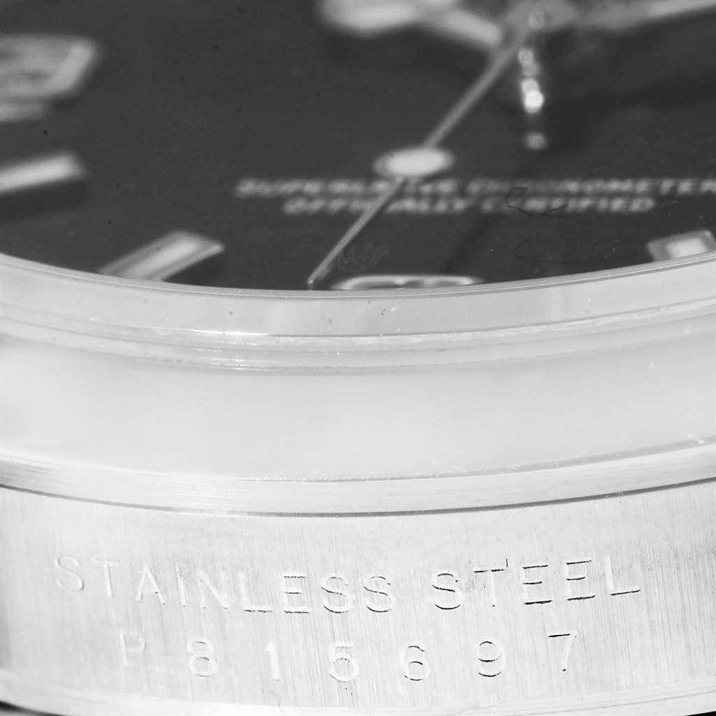 The image shows a close-up side angle of a Rolex Explorer 114270 Men's Stainless Steel Black Dial 114270 Men's Stainless Steel Black Dial watch, highlighting the stainless steel bezel with engravings.