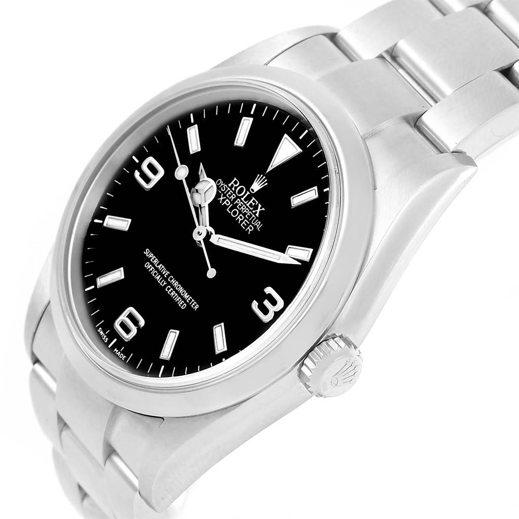 The image shows a side angle of a Rolex Explorer 114270 Men's Stainless Steel Black Dial 114270 Men's Stainless Steel Black Dial watch, highlighting its black dial, crown, and stainless steel bracelet.