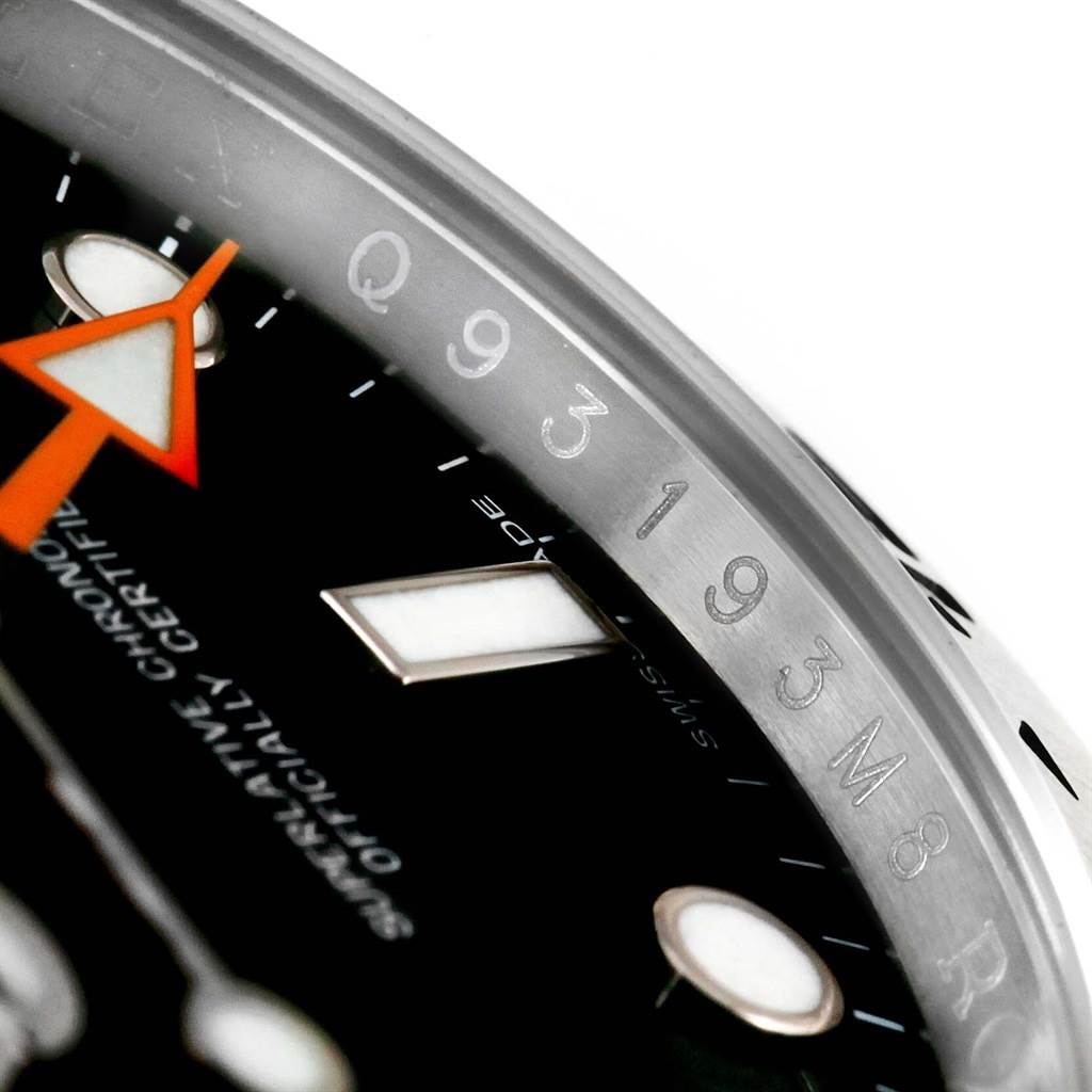 The image shows a close-up of a Rolex Explorer 216570 Men
s Black Dial 216570 Men
s Black Dial watch, focusing on the dial, bezel, and part of the hour hand.