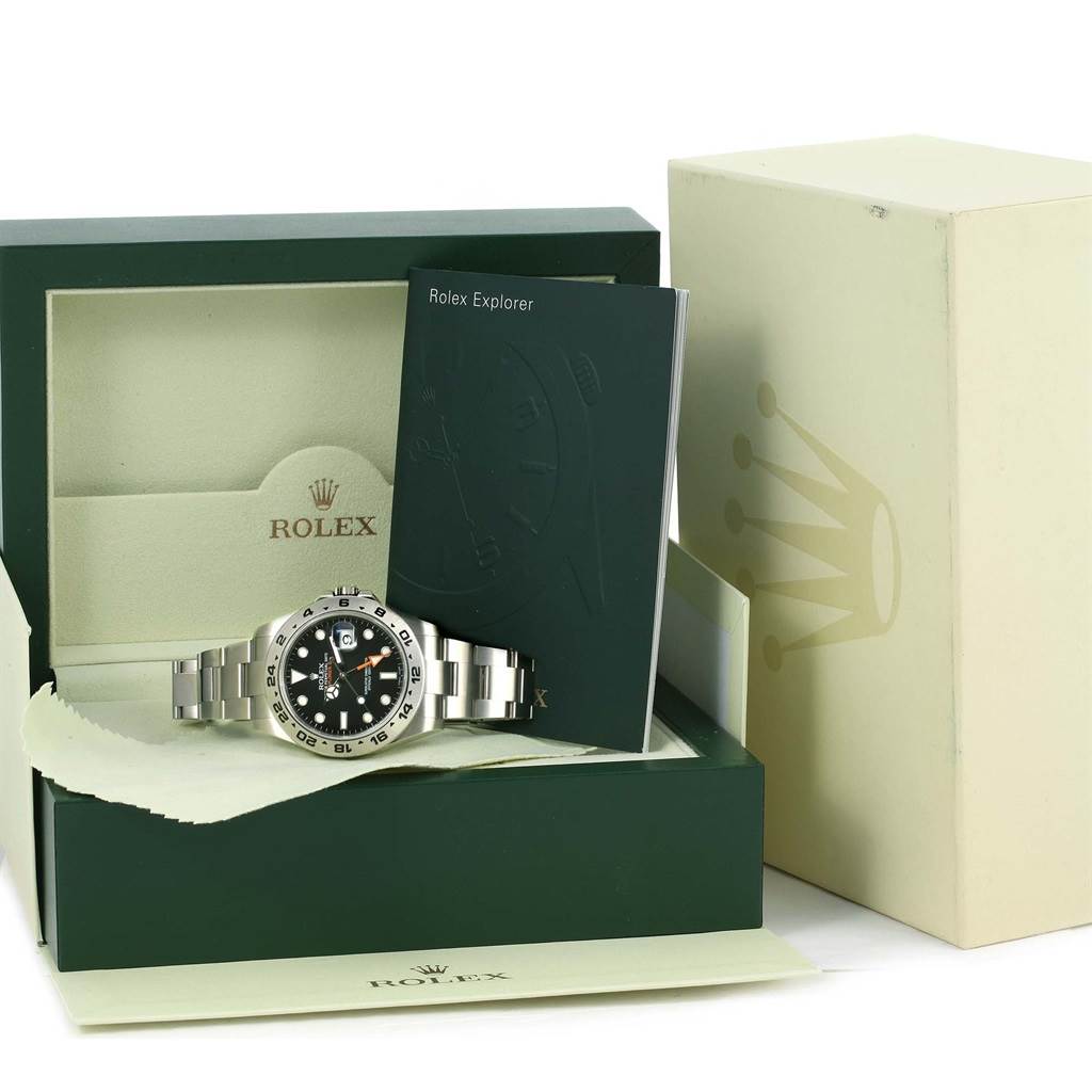 The Rolex Explorer 216570 Men
s Black Dial 216570 Men
s Black Dial watch is displayed inside its open box, accompanied by its manual and outer packaging.