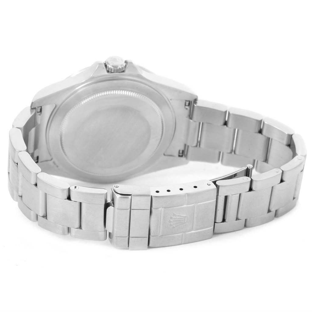 The image shows the back view of a Rolex Explorer 16570 Men's Stainless Steel White Dial 16570 Men's Stainless Steel White Dial watch, highlighting its case, crown, and bracelet clasp.