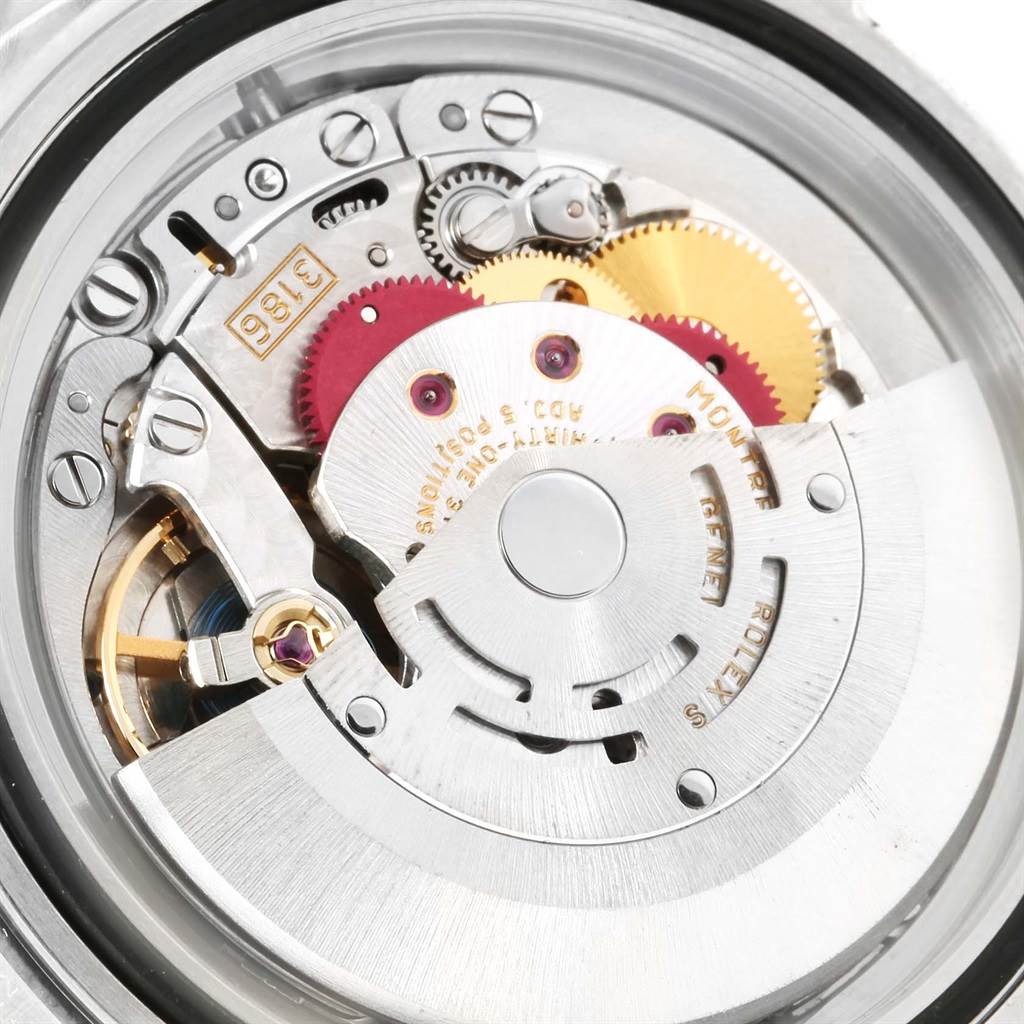This image shows the internal mechanism of a Rolex Explorer 16570 Men's Stainless Steel White Dial 16570 Men's Stainless Steel White Dial watch, highlighting gears from an angled view.
