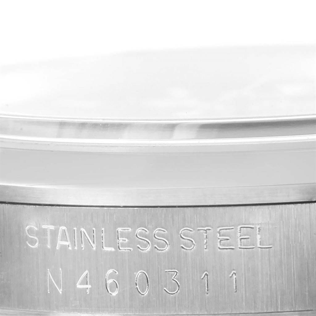 This image shows a close-up angle of the stainless steel caseback of a Rolex Explorer 14270 Men
s Stainless Steel Black Dial 14270 Men
s Stainless Steel Black Dial watch with an engraving.