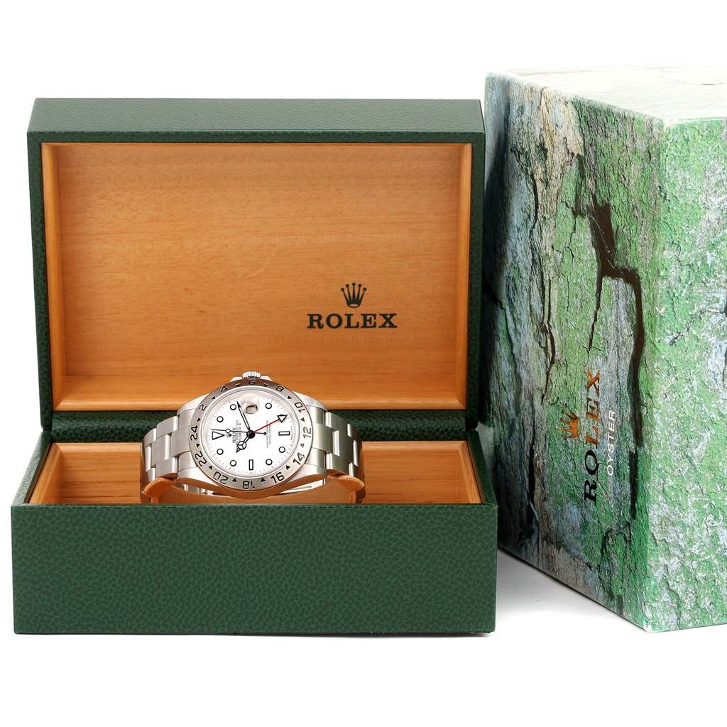 The Rolex Explorer 16570 Men's Stainless Steel White Dial 16570 Men's Stainless Steel White Dial watch is shown facing the front, displayed in an open green and wood box with the outer box beside it.