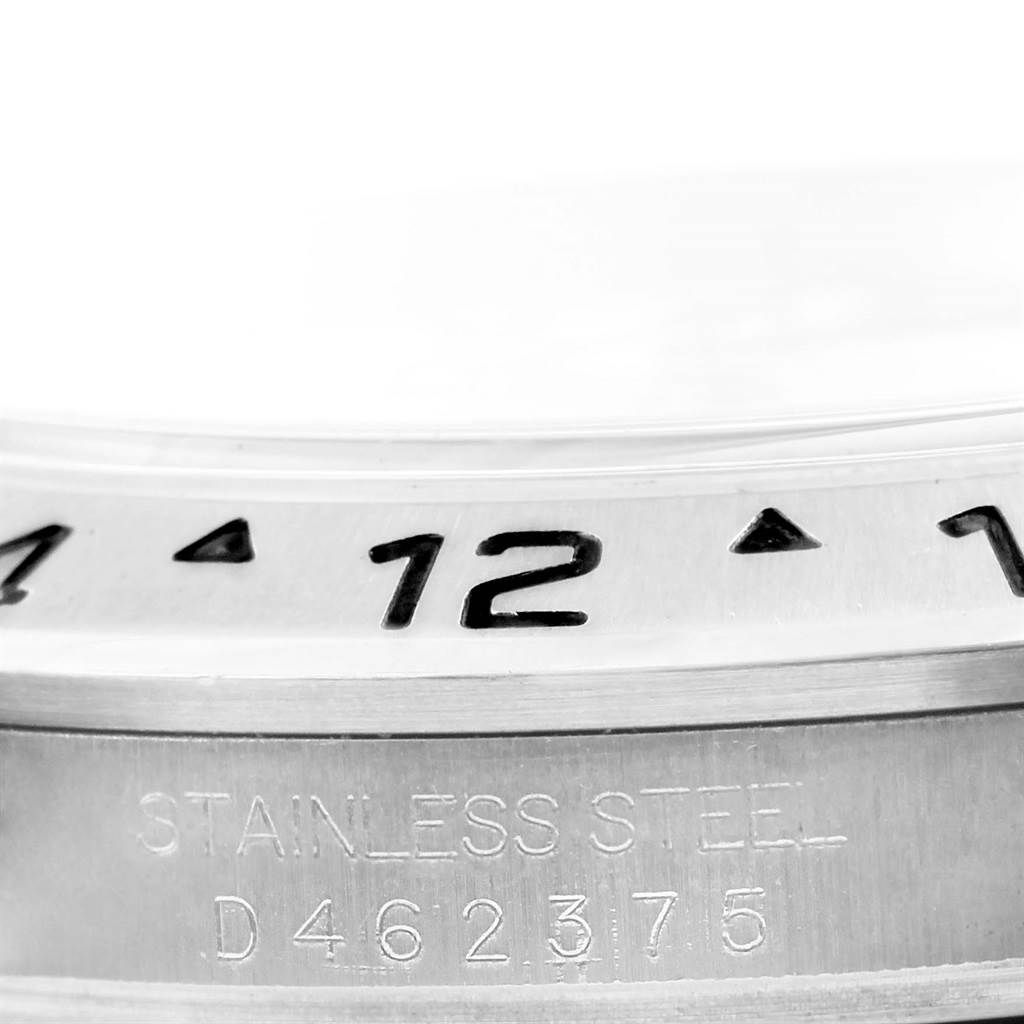 This close-up shows the bezel and case with the serial number of a Rolex Explorer 16570 Men's Stainless Steel White Dial 16570 Men's Stainless Steel White Dial watch.