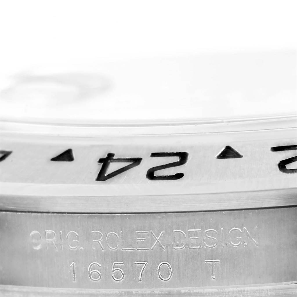 The image shows a close-up view of the bezel and engraved reference number "16570" on the Rolex Explorer 16570 Men's Stainless Steel White Dial 16570 Men's Stainless Steel White Dial watch.