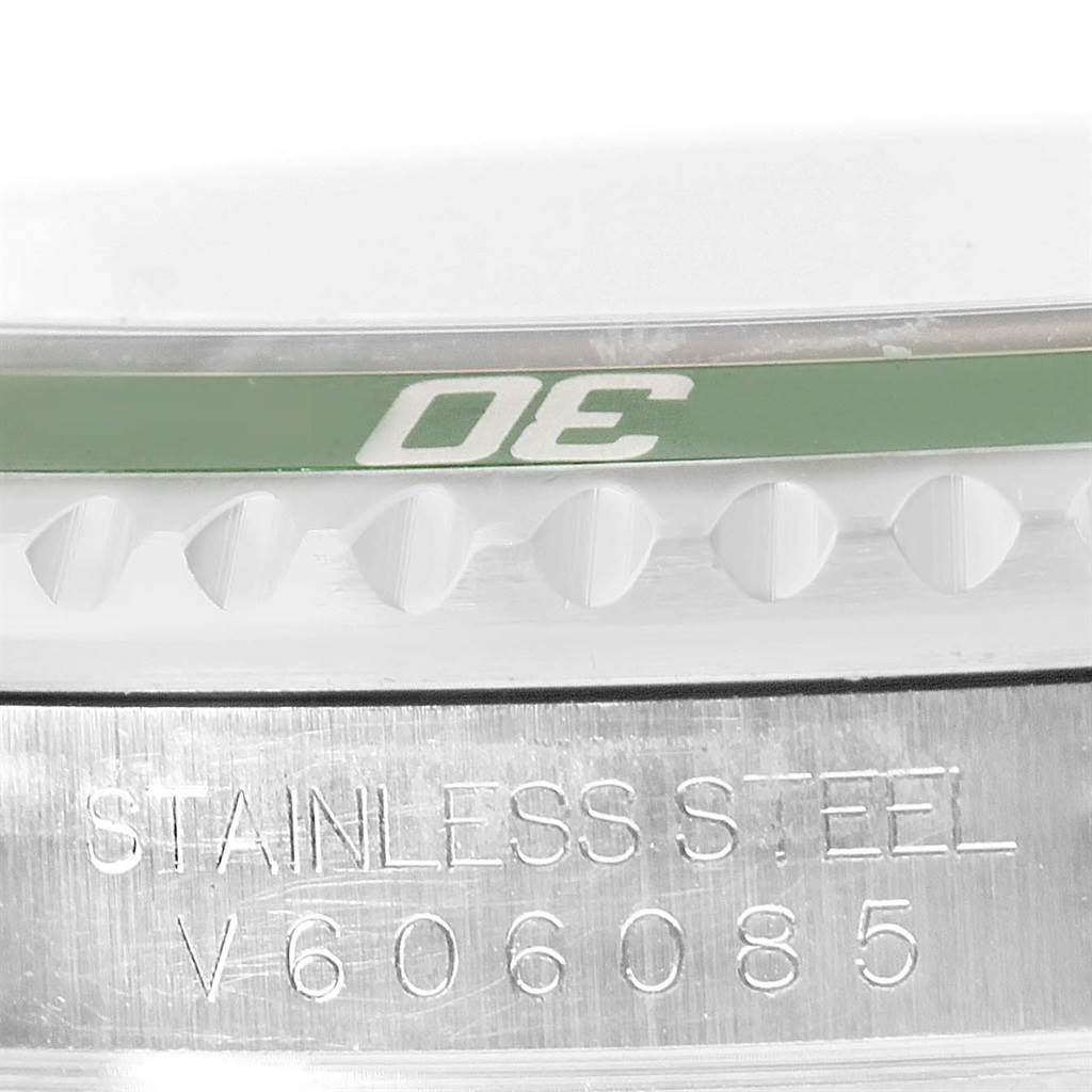 The image shows a close-up of the side of a Rolex Explorer 16610LV Men's Stainless Steel Black Dial 16610LV Men's Stainless Steel Black Dial watch, highlighting the bezel and the "STAINLESS STEEL" engraving.