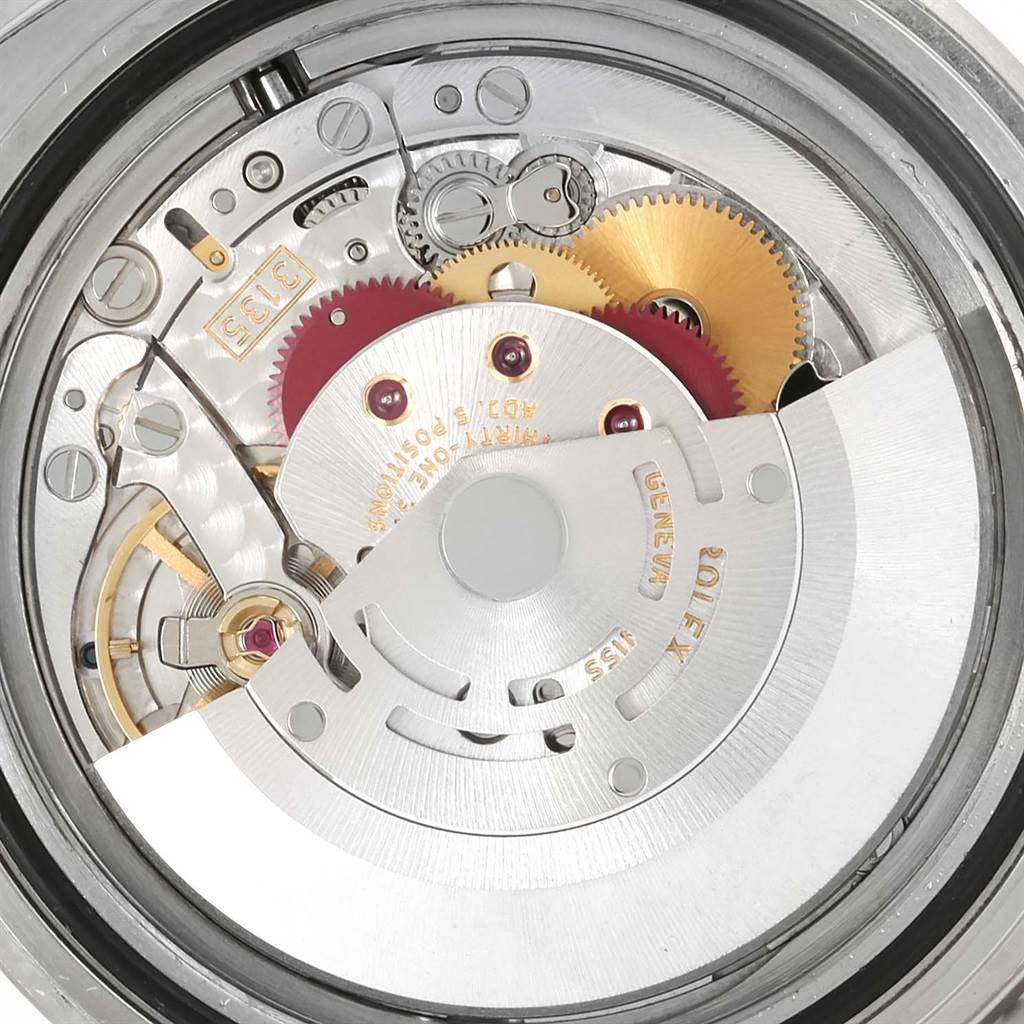 This image shows a close-up view of the movement mechanism inside a Rolex Explorer 16610LV Men's Stainless Steel Black Dial 16610LV Men's Stainless Steel Black Dial watch.