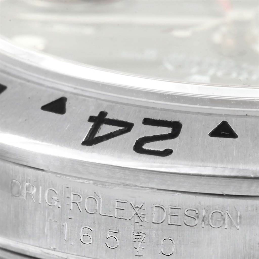 This close-up image shows the engraved bezel and model number (16570) of a Rolex Explorer 16570 Men's Stainless Steel Black Dial 16570 Men's Stainless Steel Black Dial watch.