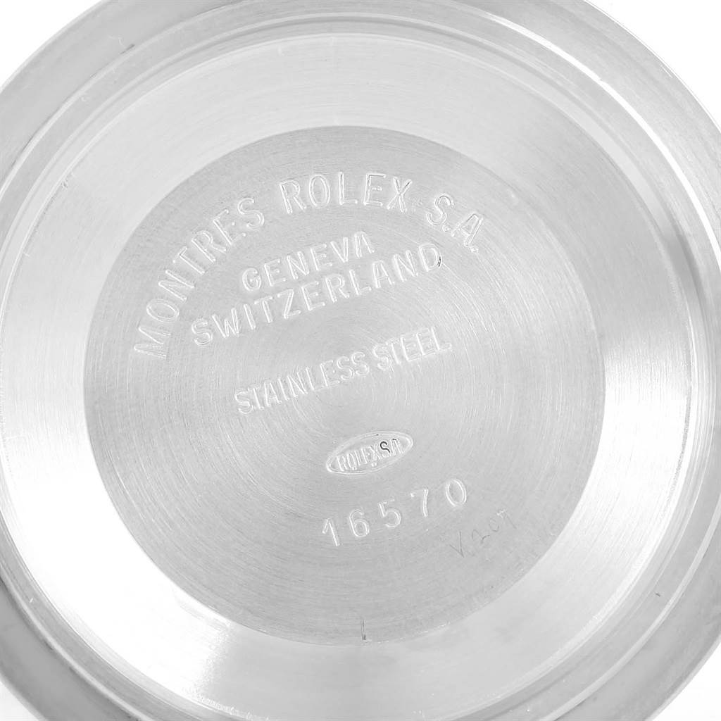 The image shows the inner case back of a Rolex Explorer 16570 Men's Stainless Steel White Dial 16570 Men's Stainless Steel White Dial watch, engraved with branding and material details.