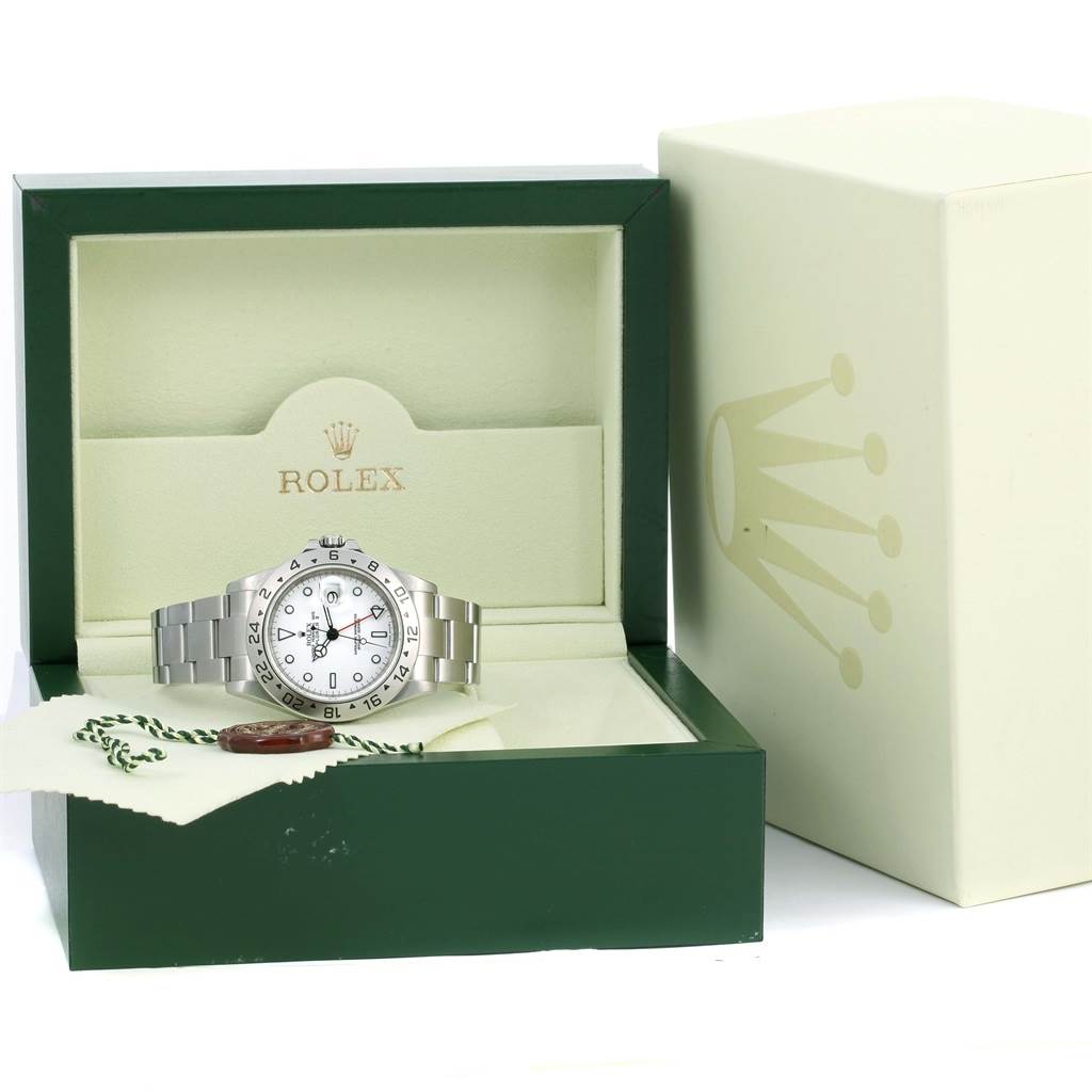 The Rolex Explorer 16570 Men's Stainless Steel White Dial 16570 Men's Stainless Steel White Dial watch is shown from the front, displayed in its open box with packaging accessories beside it.