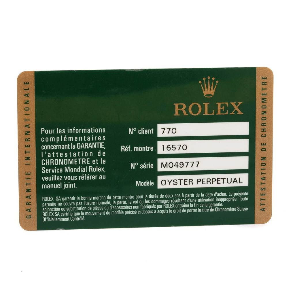 The image shows a Rolex warranty card for the Explorer model, including the reference and serial numbers, viewed from the front.