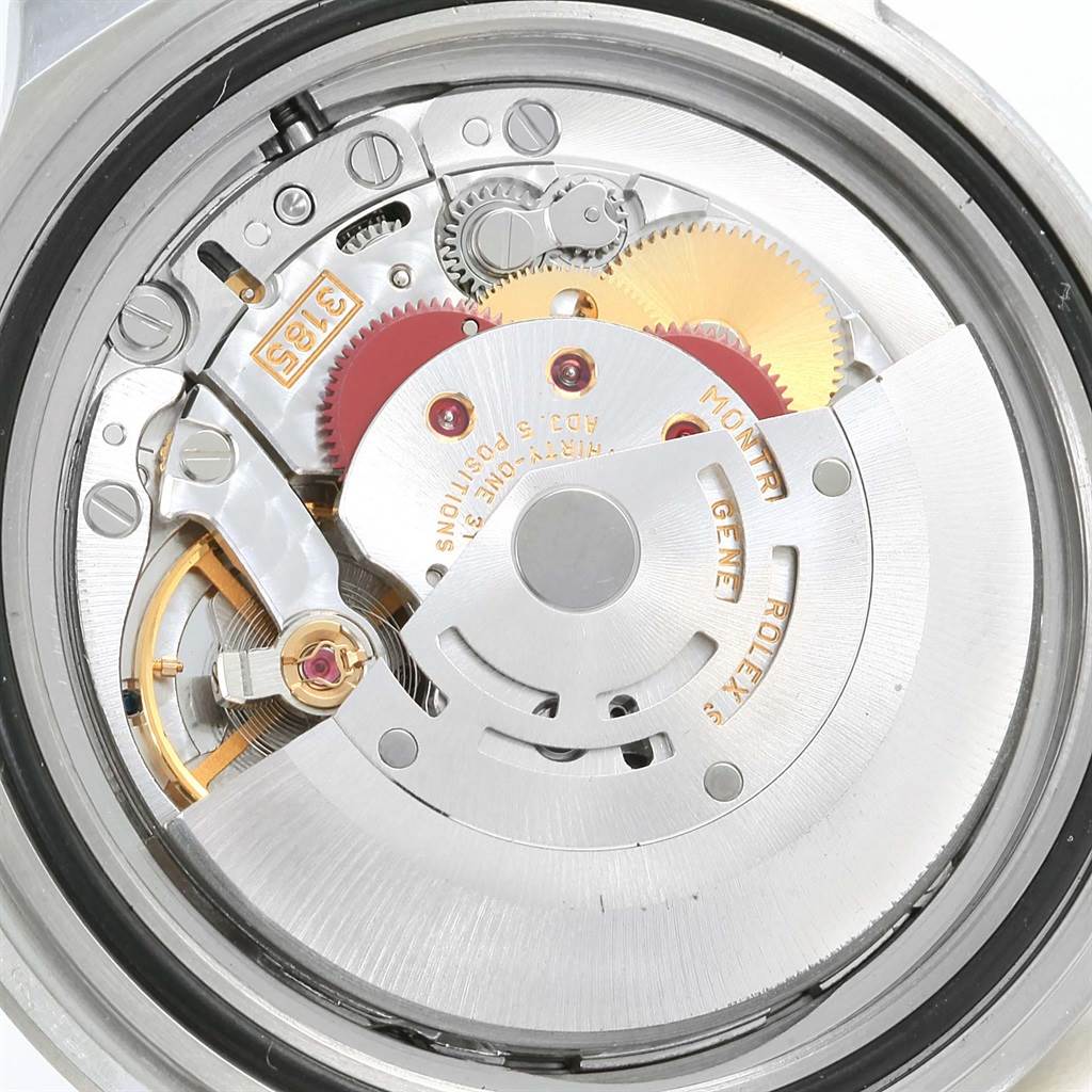 The image shows an interior view of a Rolex Explorer 16570 Men's Stainless Steel White Dial 16570 Men's Stainless Steel White Dial model, specifically its intricate movement and mechanical parts.