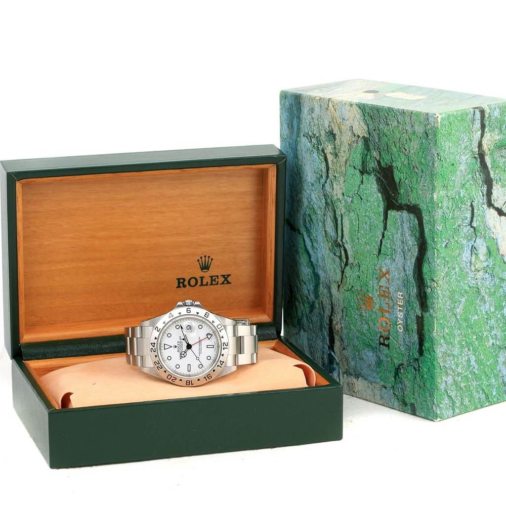 The Rolex Explorer 16570 Men's Stainless Steel White Dial 16570 Men's Stainless Steel White Dial watch is shown in an open case, placed angled front-right, with its box and packaging visible.