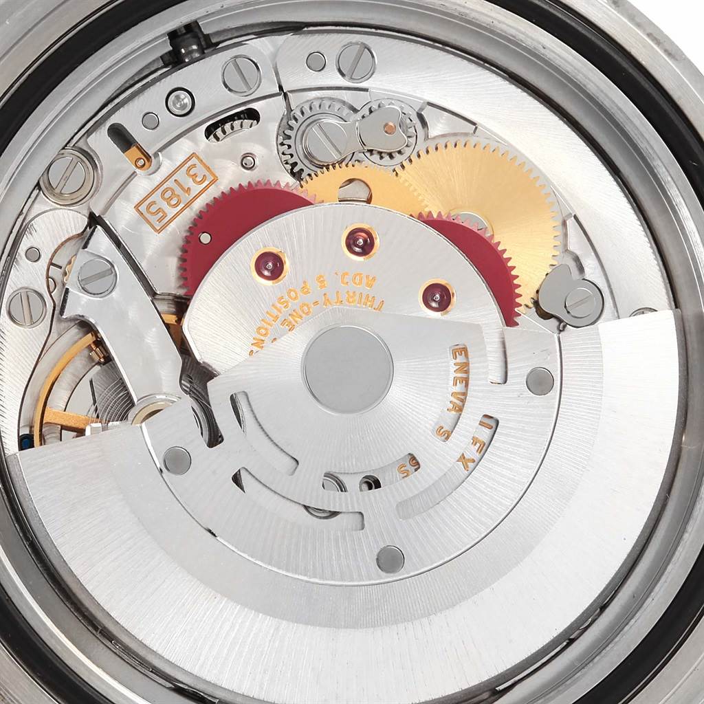 The image shows the internal mechanism of the Rolex Explorer 16570 Men's Stainless Steel White Dial 16570 Men's Stainless Steel White Dial watch, highlighting the gears and movement components from a top-down angle.