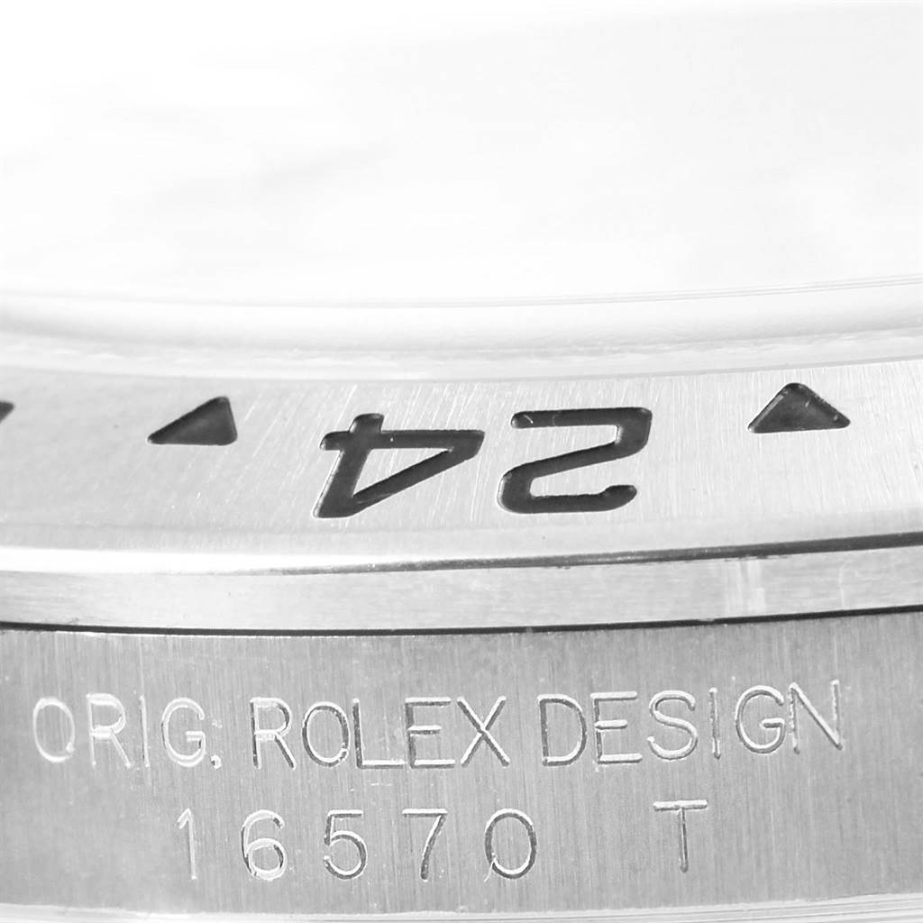 Close-up of the Rolex Explorer 16570 Men's Stainless Steel White Dial 16570 Men's Stainless Steel White Dial model showing the bezel and engraved text on the case.