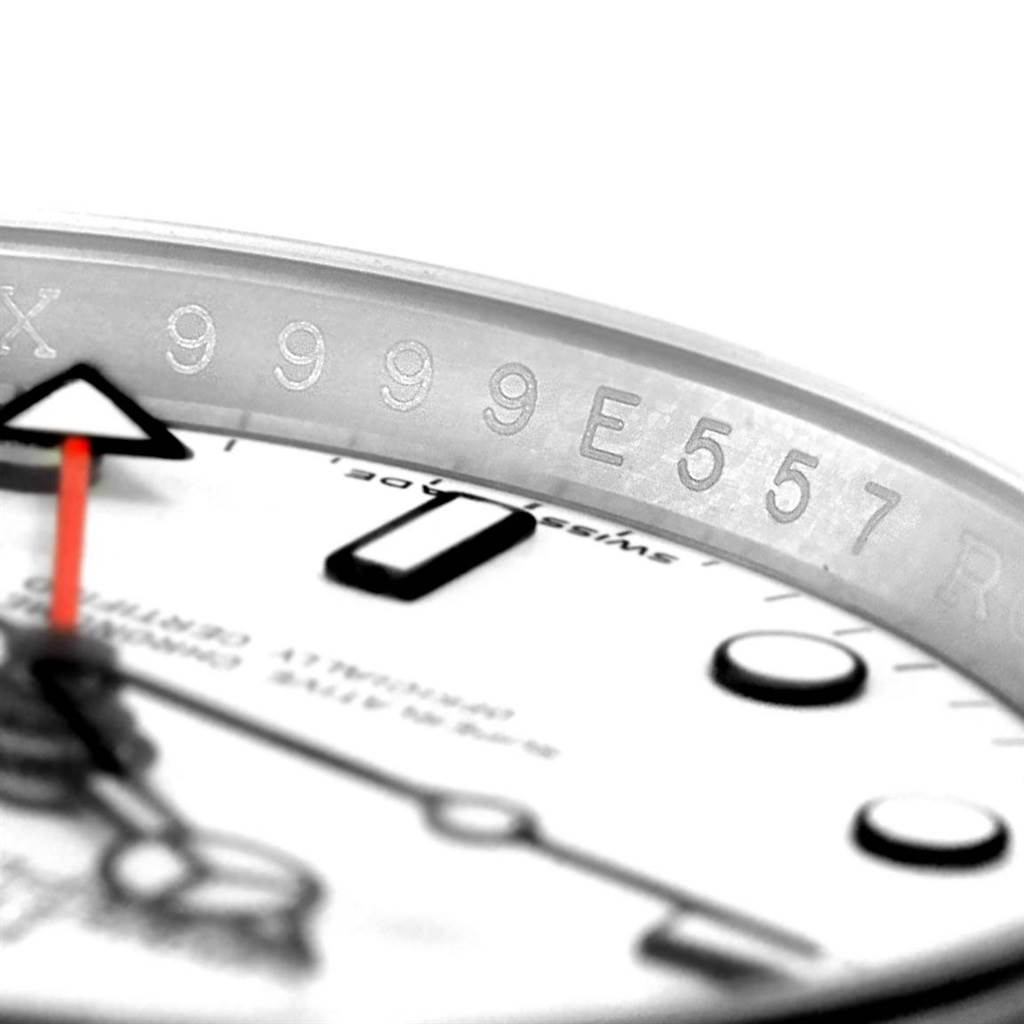 The image shows a close-up angle of the dial and serial number engraving on a Rolex Explorer 16570 Men's Stainless Steel White Dial 16570 Men's Stainless Steel White Dial watch.