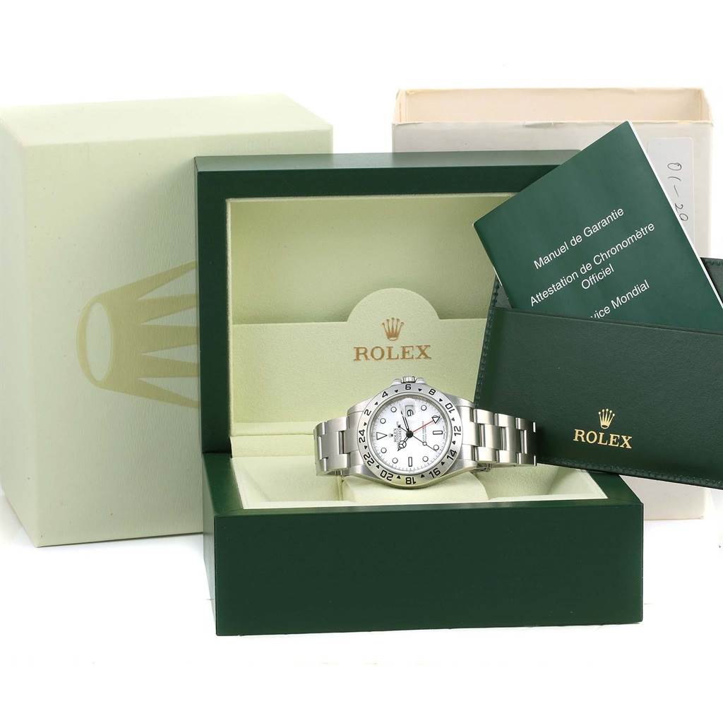 The image shows a Rolex Explorer 16570 Men's Stainless Steel White Dial 16570 Men's Stainless Steel White Dial watch with its box, manuals, and warranty card holder.