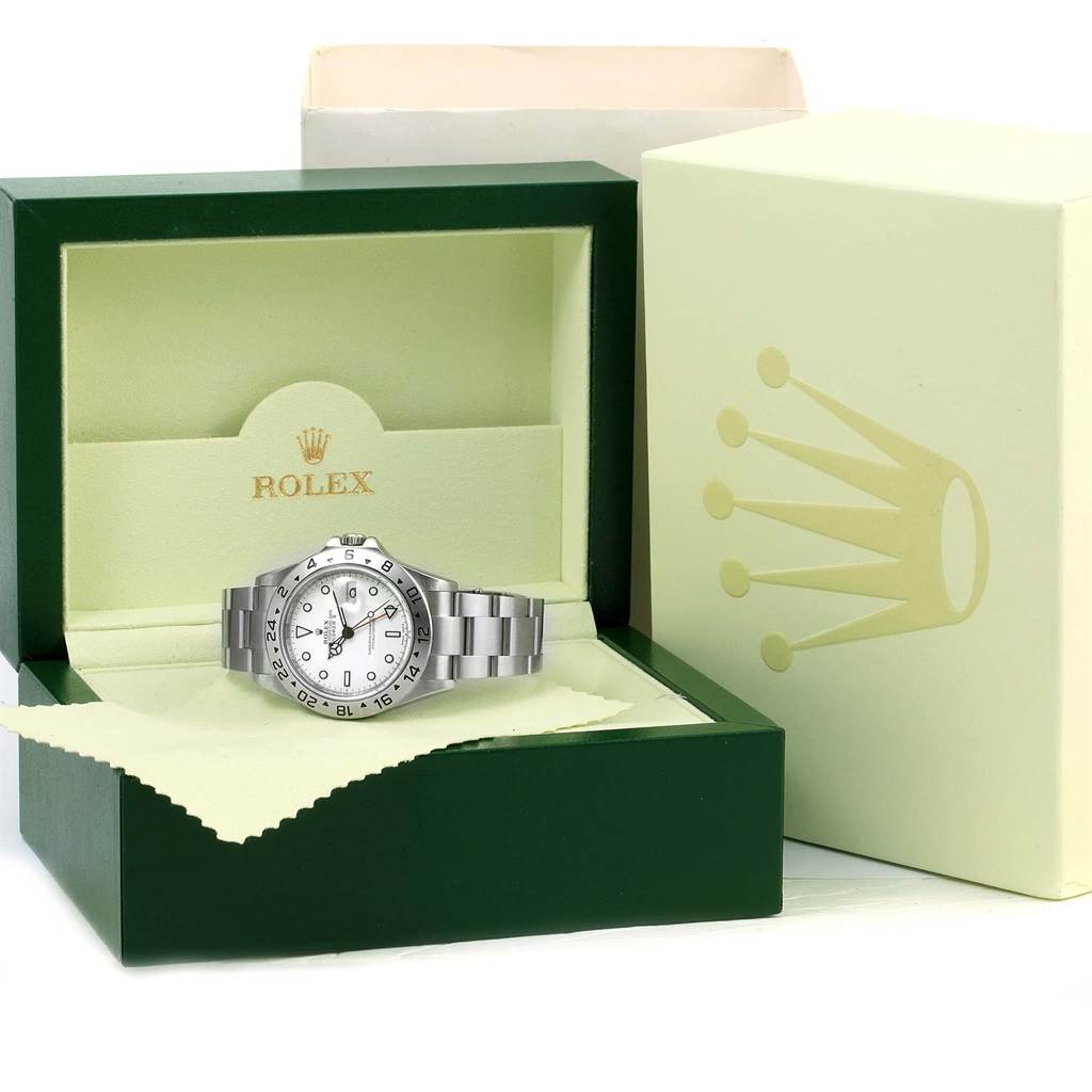The Rolex Explorer 16570 Men's Stainless Steel White Dial 16570 Men's Stainless Steel White Dial watch is shown angled in its open box, revealing its face, bezel, and band.
