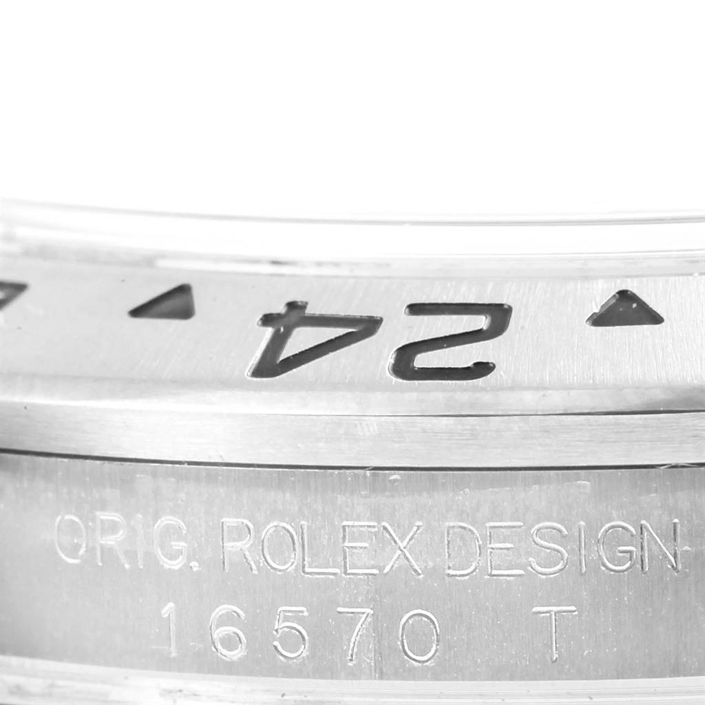 This image shows a close-up view of the bezel and engraved side of a Rolex Explorer 16570 Men's Stainless Steel White Dial 16570 Men's Stainless Steel White Dial watch, model number 16570.
