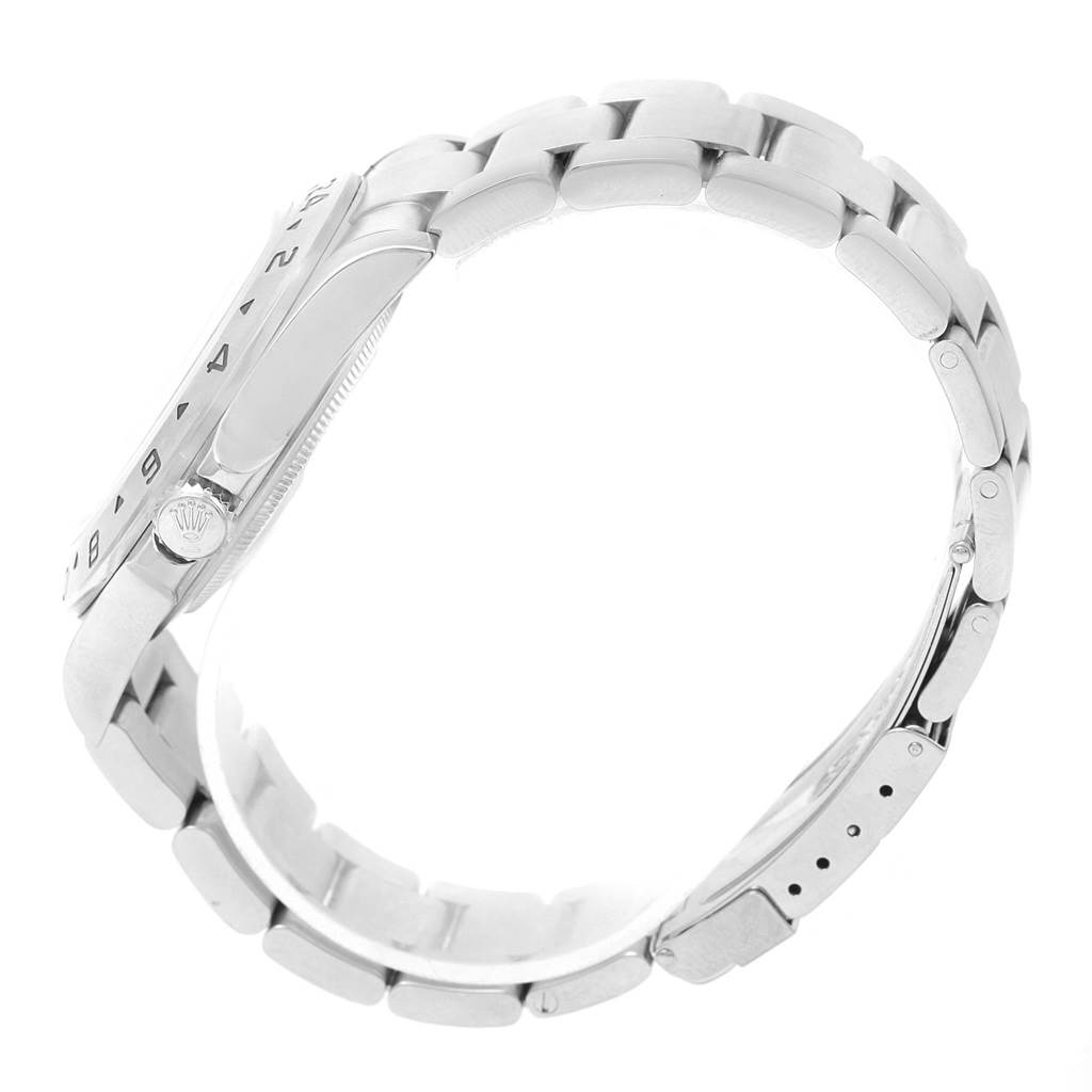 The image shows a side view of a Rolex Explorer 16570 Men
s Stainless Steel White Dial 16570 Men
s Stainless Steel White Dial watch, highlighting its crown, bezel, and bracelet links.