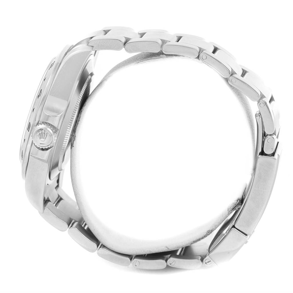 This side view of the Rolex Explorer 216570 Men's Stainless Steel White Dial 216570 Men's Stainless Steel White Dial watch showcases the crown, case, and metal bracelet.