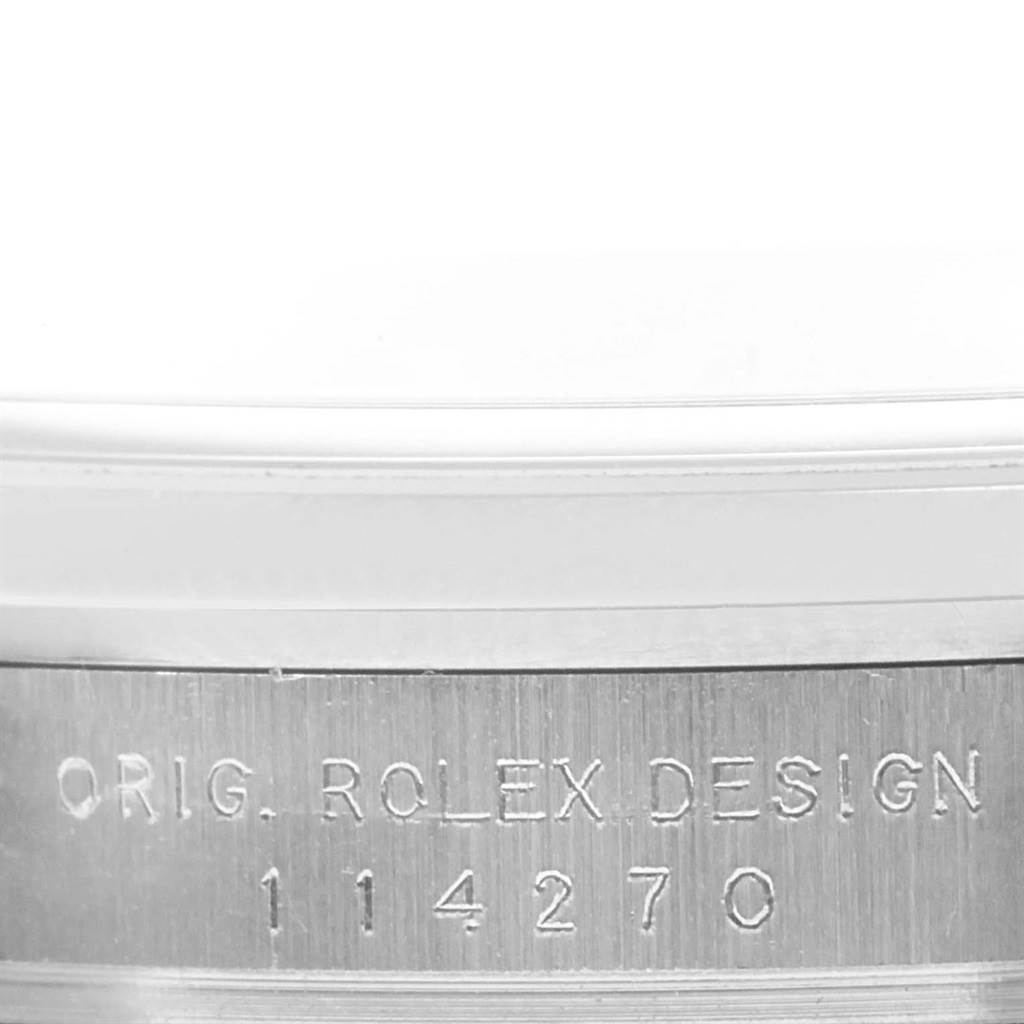 This image shows a close-up of the case back engraving on a Rolex Explorer 114270 Men's Stainless Steel Black Dial 114270 Men's Stainless Steel Black Dial watch, model number 114270.