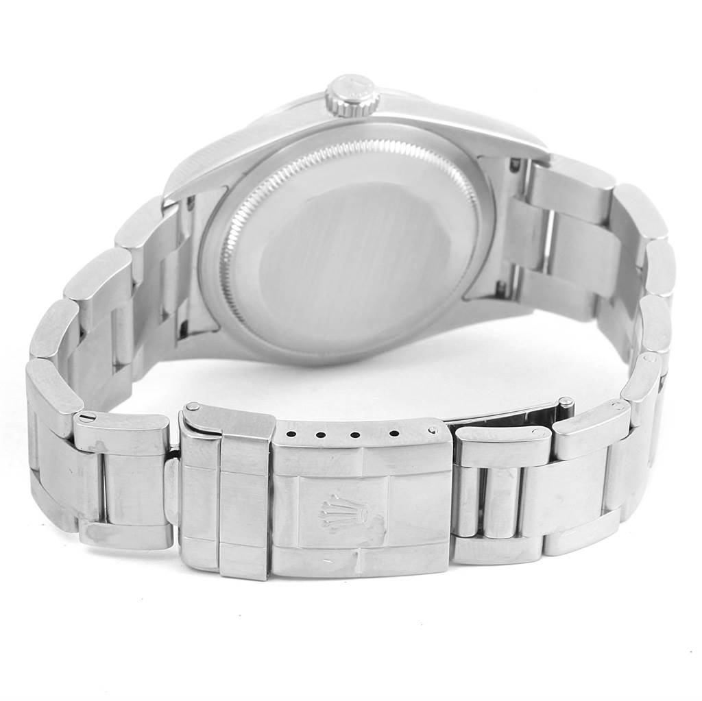 The image shows the backside and bracelet of a Rolex Explorer 114270 Men's Stainless Steel Black Dial 114270 Men's Stainless Steel Black Dial watch, focusing on the case back and deployant clasp.