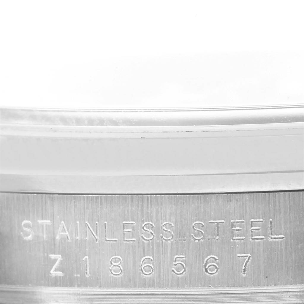 This image shows a close-up of the stainless steel engraving on the case back of a Rolex Explorer 114270 Men's Stainless Steel Black Dial 114270 Men's Stainless Steel Black Dial watch.