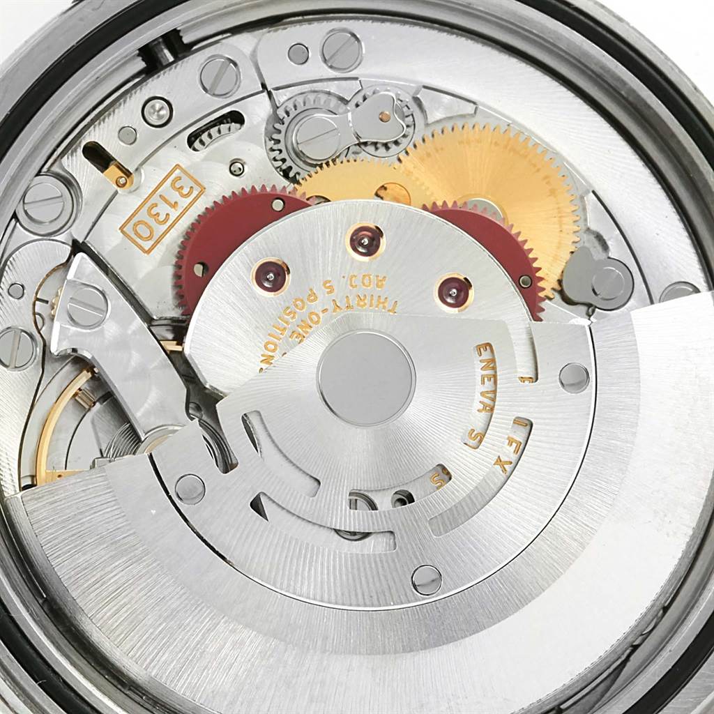 This close-up image shows the intricate movement parts and gears of a Rolex Explorer 114270 Men's Stainless Steel Black Dial 114270 Men's Stainless Steel Black Dial watch's internal mechanism.
