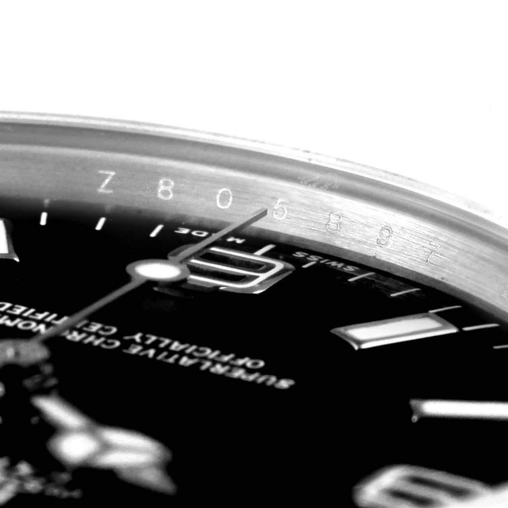 This image shows a close-up of the dial and bezel edge of the Rolex Explorer 114270 Men's Stainless Steel Black Dial 114270 Men's Stainless Steel Black Dial watch, including part of its serial number.