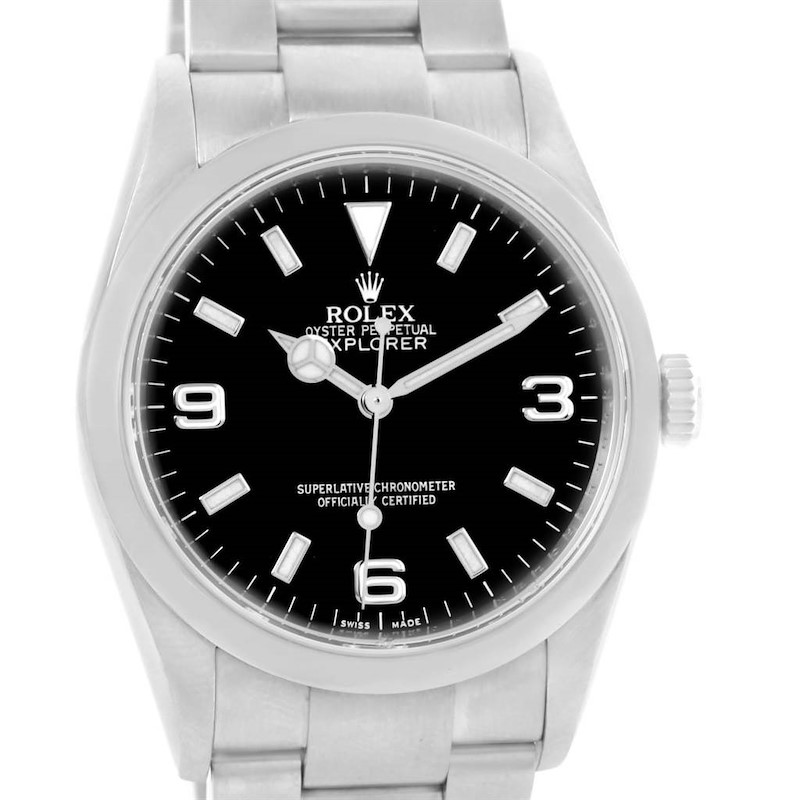 The Rolex Explorer watch is shown from a front angle, highlighting its dial, case, crown, and part of the bracelet.