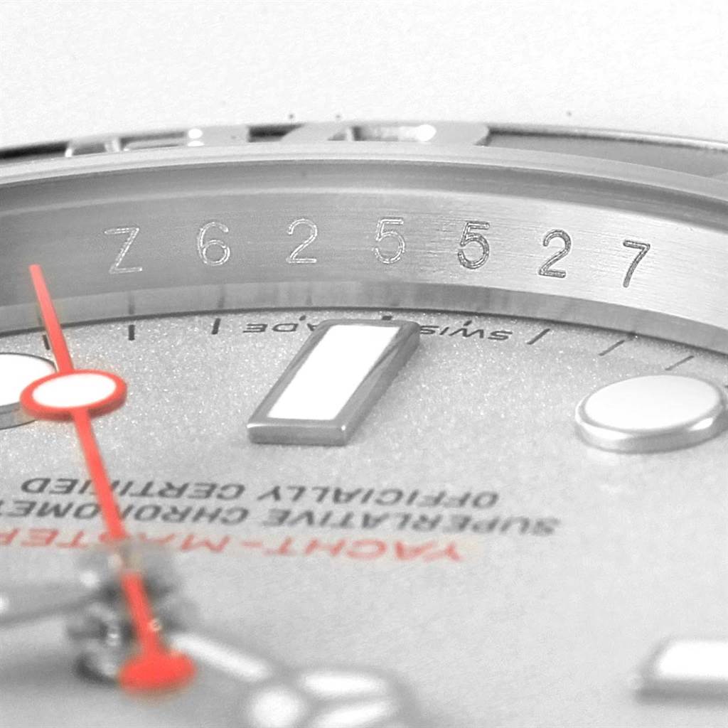 The image shows a close-up angle of a Rolex Explorer 16622 Men's Stainless Steel Silver Dial 16622 Men's Stainless Steel Silver Dial dial, including part of the bezel with engraved serial numbers.