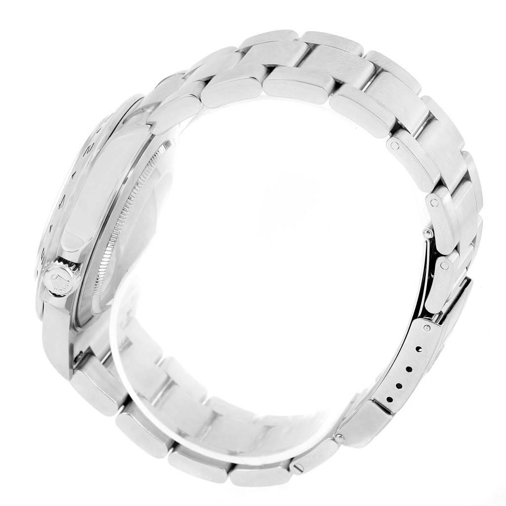 This image shows a side angle of the Rolex Explorer 16570 Men's Stainless Steel White Dial 16570 Men's Stainless Steel White Dial watch focusing on the bracelet and crown.