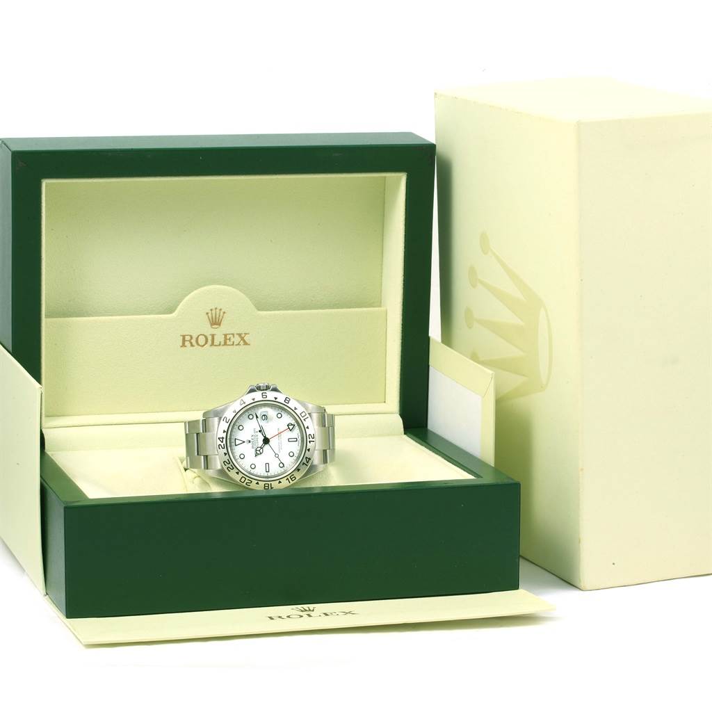 The Rolex Explorer 16570 Men's Stainless Steel White Dial 16570 Men's Stainless Steel White Dial watch is displayed front-facing in an open green and cream Rolex box, with outer packaging also visible.