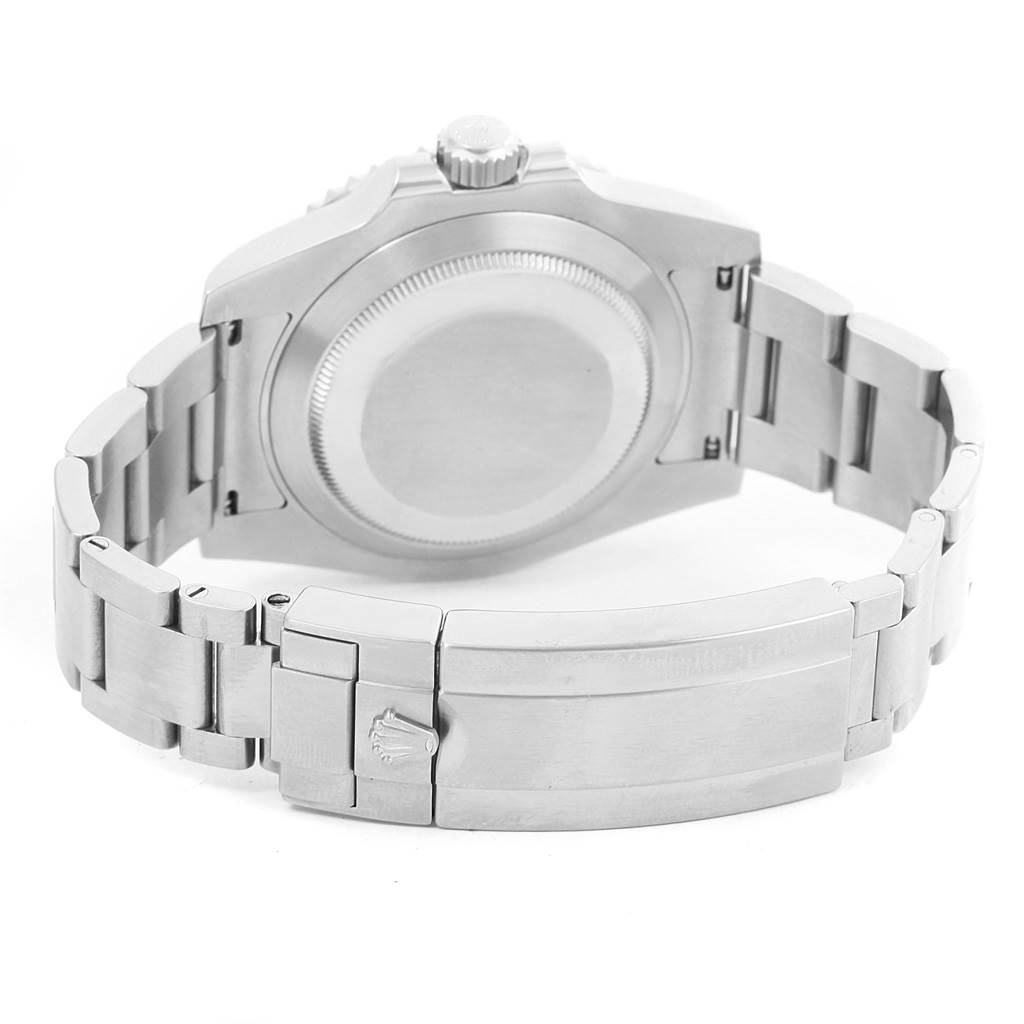 This image shows the backside of a Rolex Explorer 114060 Men's Stainless Steel Black Dial 114060 Men's Stainless Steel Black Dial watch, including the case back, bracelet, and clasp.