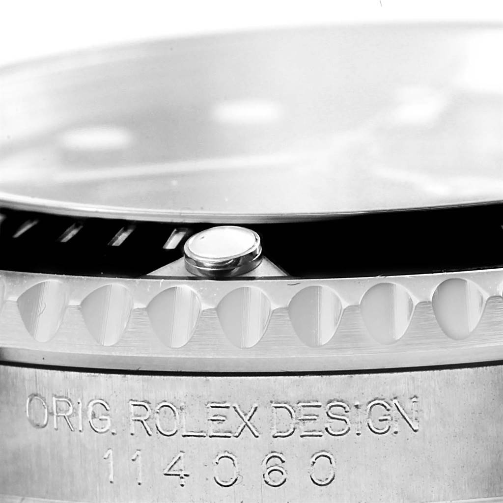 Close-up angle of a Rolex Explorer 114060 Men's Stainless Steel Black Dial 114060 Men's Stainless Steel Black Dial watch, highlighting the bezel edge and case with engraved design and model number (114060).