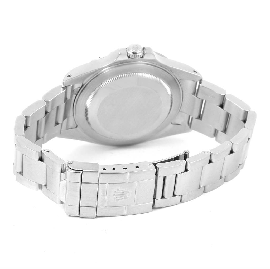 The image shows the back and clasp of a Rolex Explorer 16570 Men's Stainless Steel White Dial 16570 Men's Stainless Steel White Dial watch, highlighting its metal bracelet and case back.