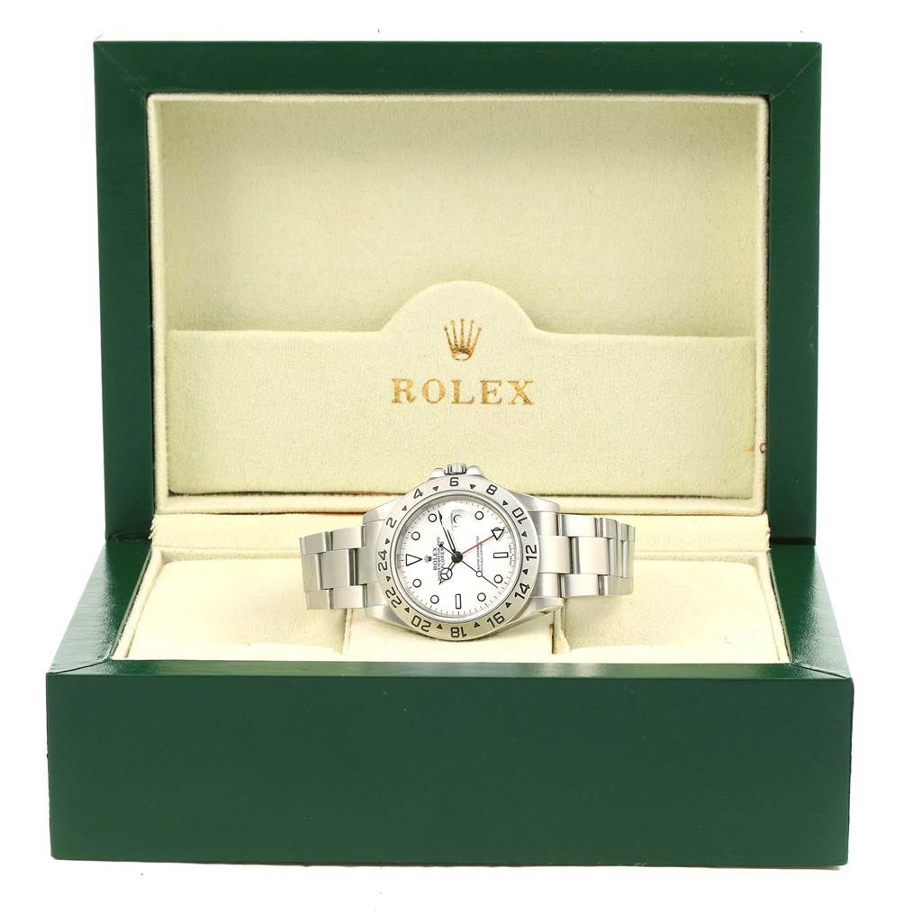 The Rolex Explorer 16570 Men's Stainless Steel White Dial 16570 Men's Stainless Steel White Dial watch is displayed frontally in its green and beige box.