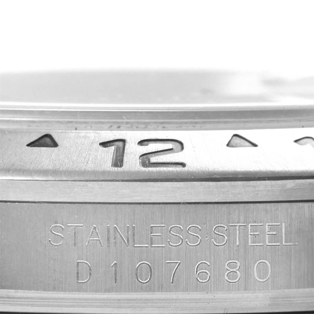 This image shows a close-up of the bezel and serial number engraving of a Rolex Explorer 16570 Men's Stainless Steel White Dial 16570 Men's Stainless Steel White Dial watch.