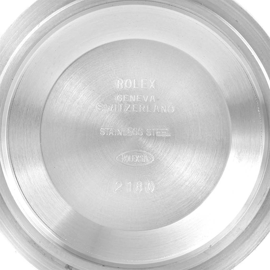 This image shows the inside of the case back of a Rolex Explorer 16570 Men's Stainless Steel White Dial 16570 Men's Stainless Steel White Dial watch, highlighting the "Rolex", "Geneva", "Switzerland", and "Stainless Steel" engravings.