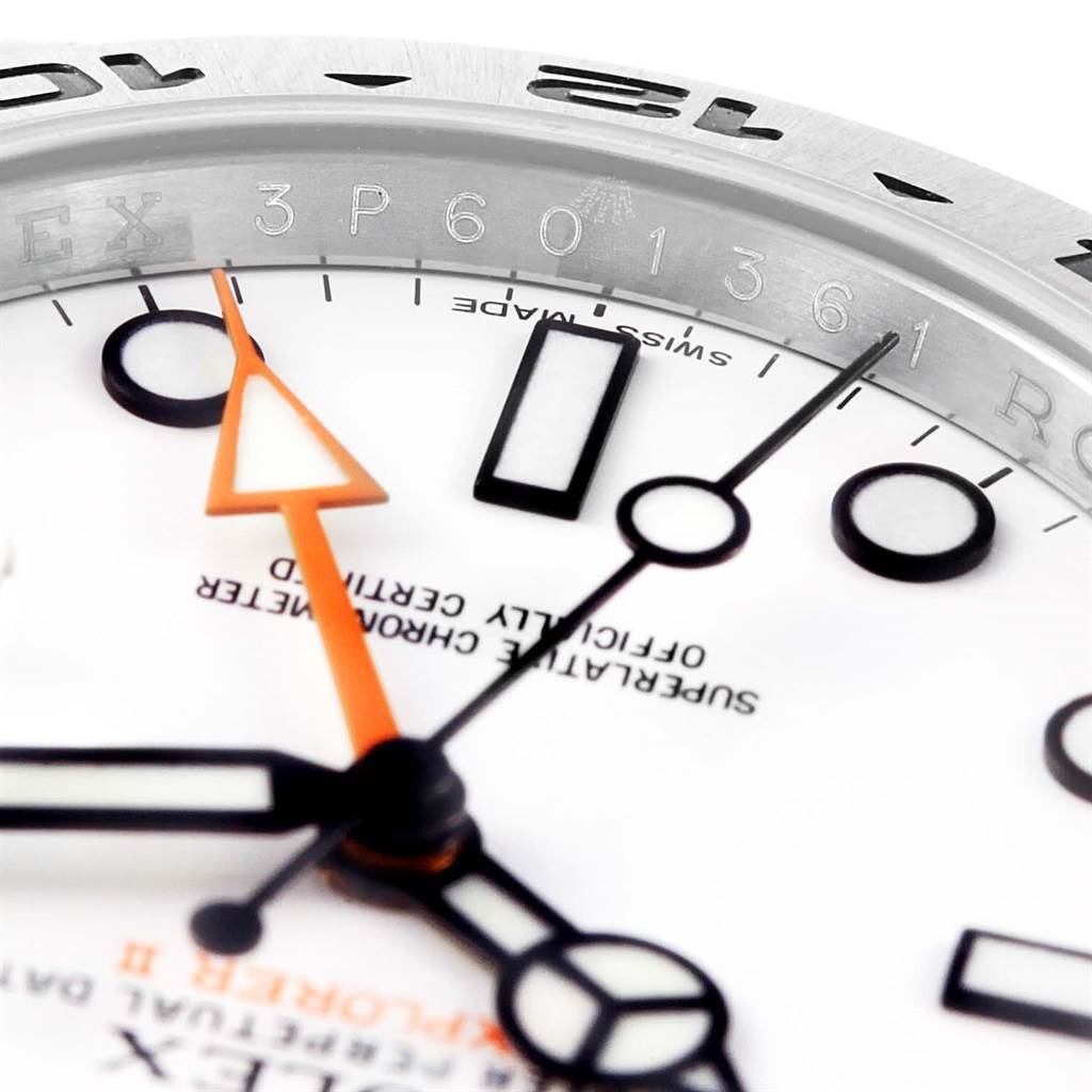 This close-up image of the Rolex Explorer 216570 Men's Stainless Steel White Dial 216570 Men's Stainless Steel White Dial watch focuses on the dial, hands, and part of the chapter ring.