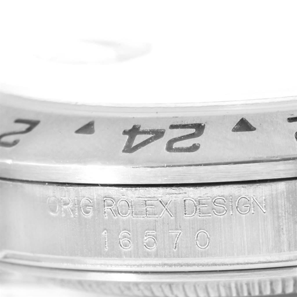 This is a close-up of the bezel and case side showing the model number "16570" of the Rolex Explorer 16570 Men's Stainless Steel White Dial 16570 Men's Stainless Steel White Dial watch.
